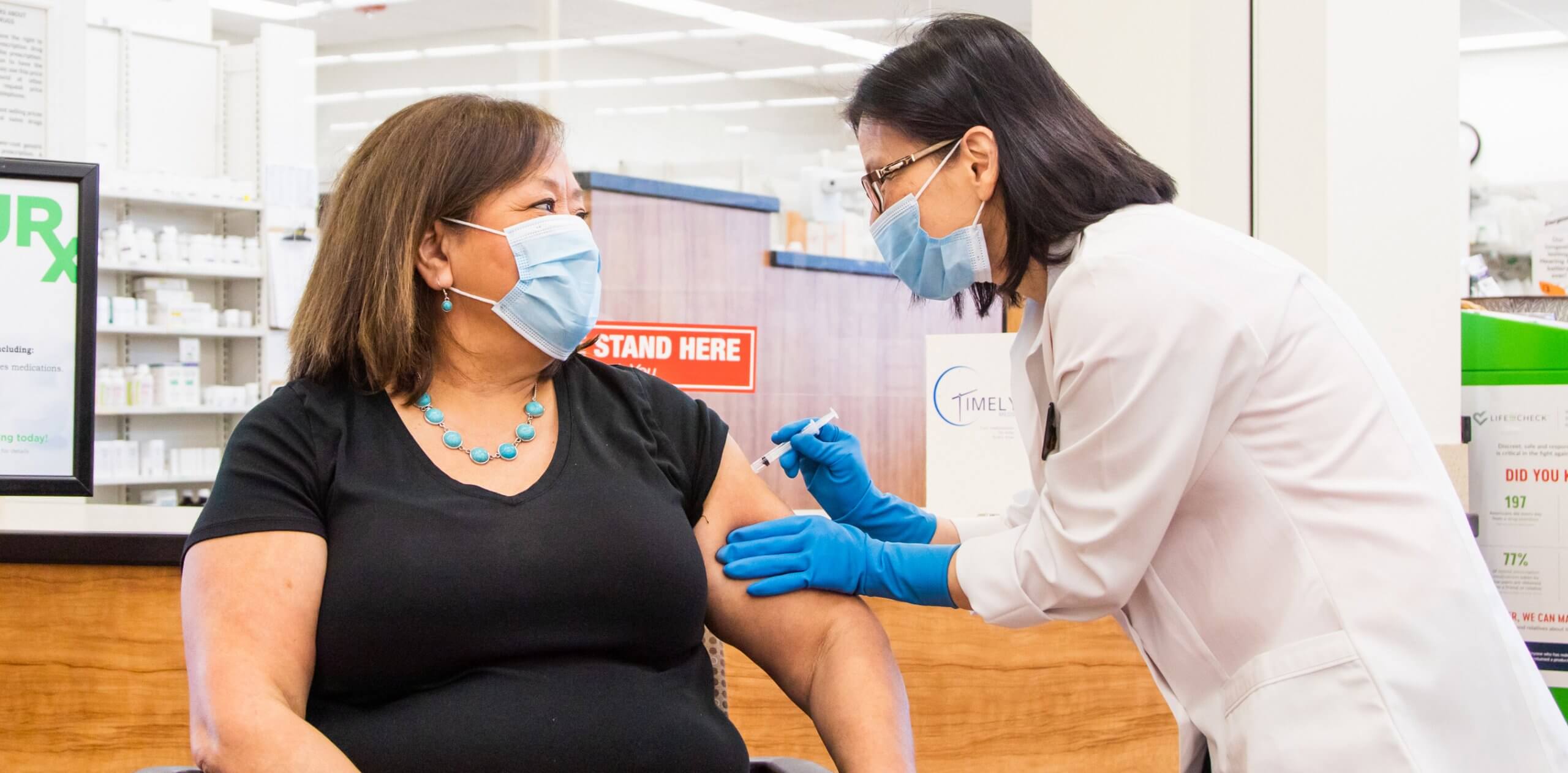 Administering a shot at an in-store pharmacy